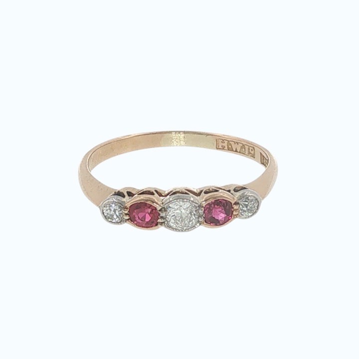 An antique 18ct yellow gold ring featuring a five-stone setting with alternating rubies and diamonds. View II