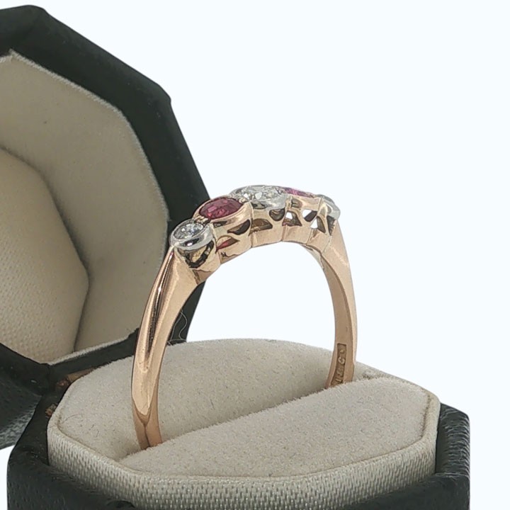An antique 18ct yellow gold ring featuring a five-stone setting with alternating rubies and diamonds. View III