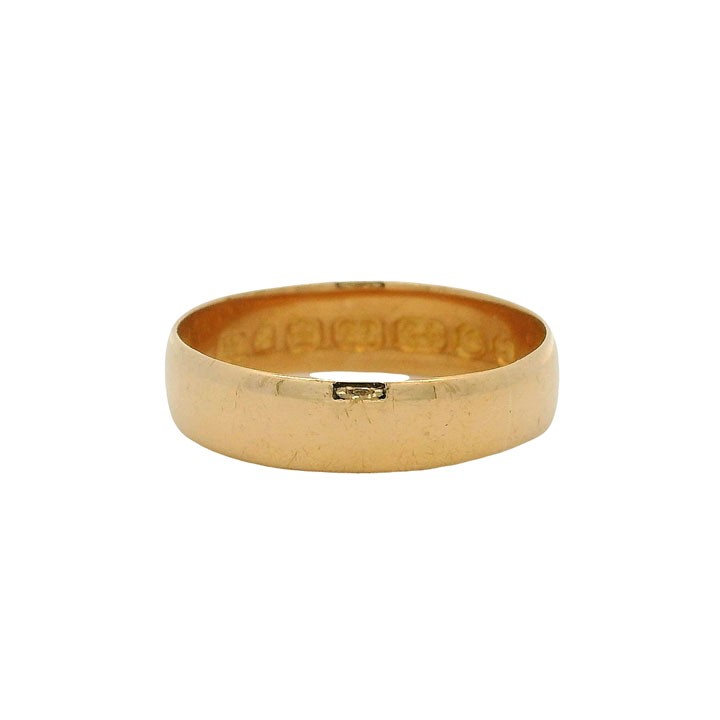 A plain 22ct yellow gold Victorian wedding band with visible internal hallmarks set against a white background.