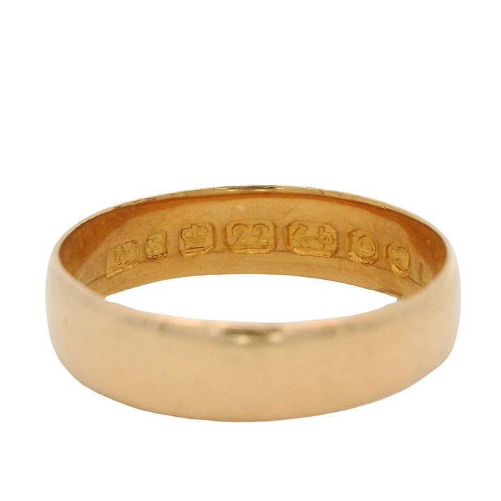 A plain 22ct yellow gold Victorian wedding band with visible internal hallmarks set against a white background. View II