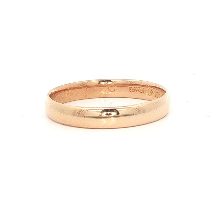 A plain 3mm 22ct yellow gold wedding band ring displaying visible internal hallmarks. View II