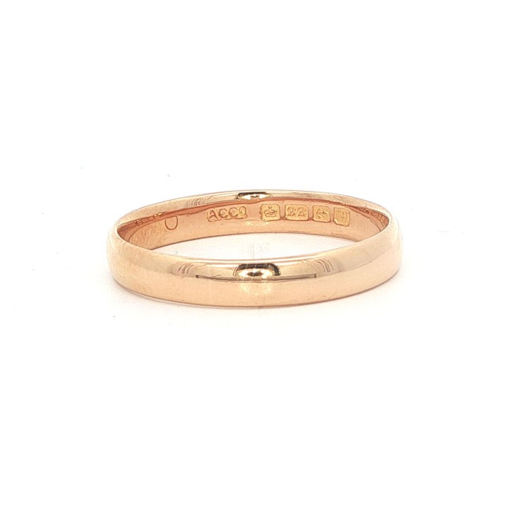 A plain 3mm 22ct yellow gold wedding band ring displaying visible internal hallmarks. View III
