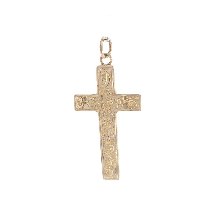 An antique Edwardian 9ct yellow gold cross pendant decorated with detailed hand-engraved scrollwork and fitted with a top loop.
