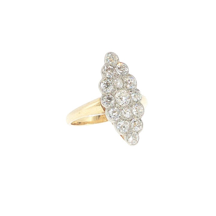 An Edwardian navette cluster ring featuring multiple old cut diamonds set in platinum with an 18ct yellow gold band. View II
