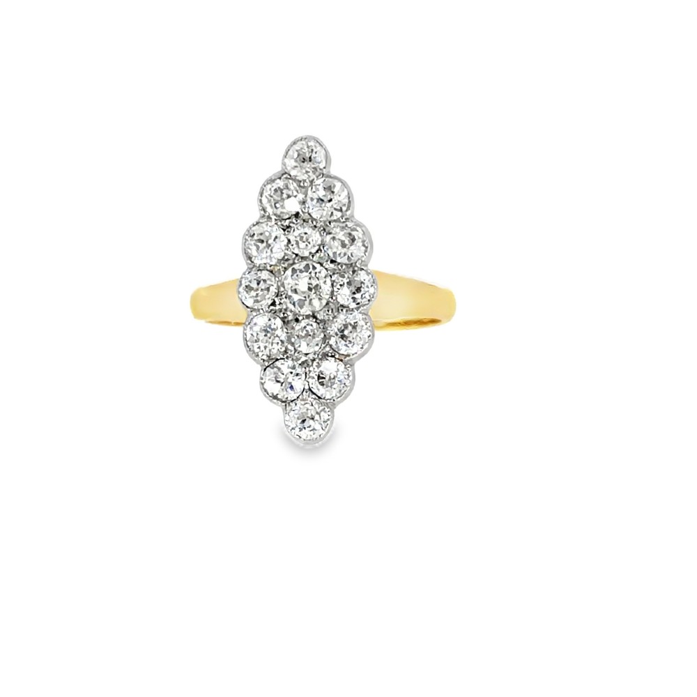 An Edwardian navette cluster ring featuring multiple old cut diamonds set in platinum with an 18ct yellow gold band. View IV