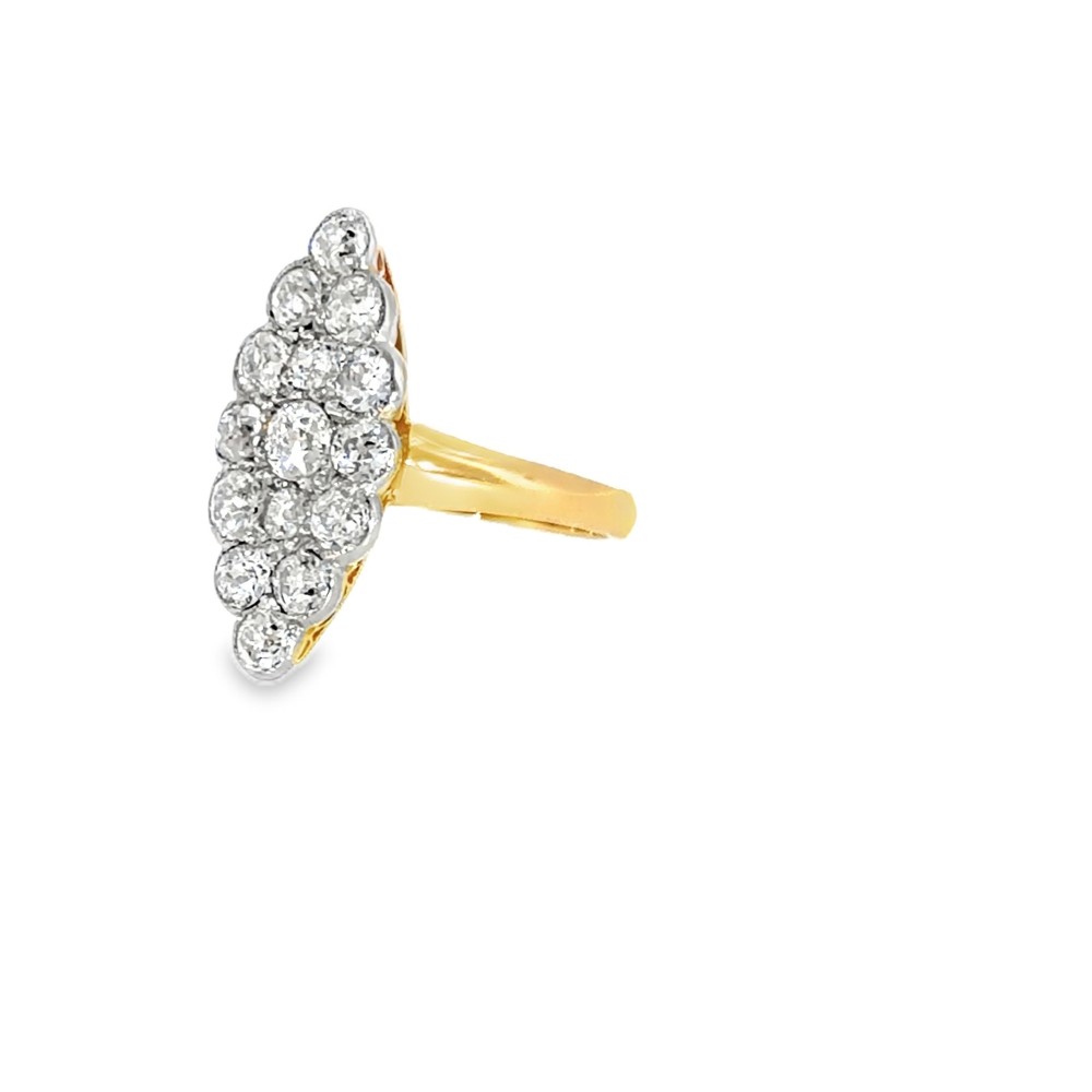 An Edwardian navette cluster ring featuring multiple old cut diamonds set in platinum with an 18ct yellow gold band. View V