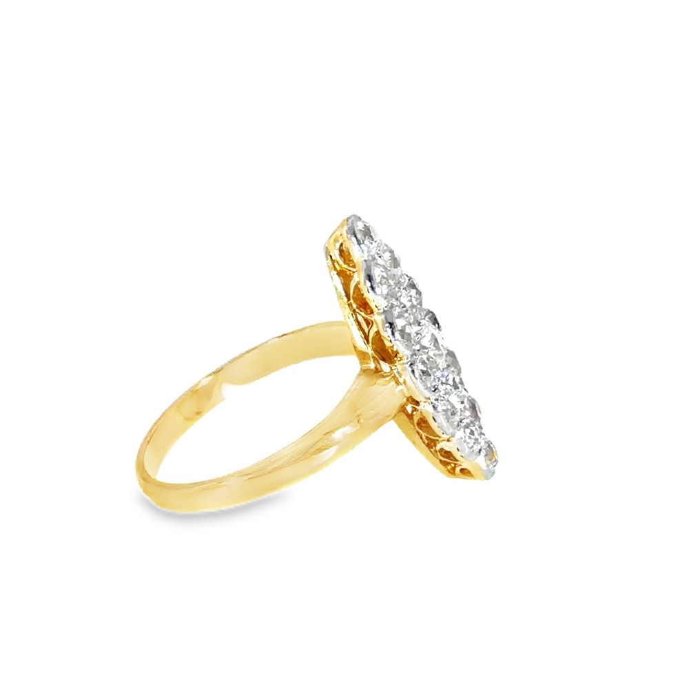 An Edwardian navette cluster ring featuring multiple old cut diamonds set in platinum with an 18ct yellow gold band. View VII