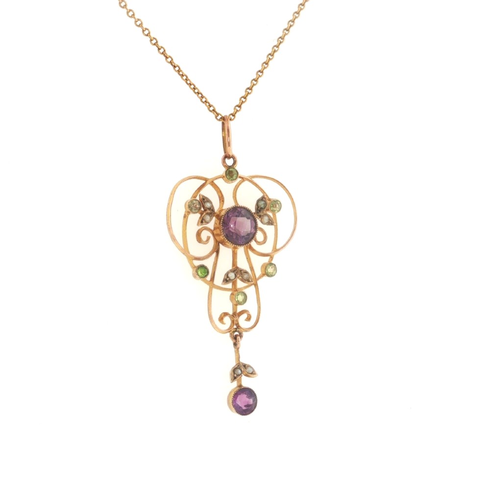 An openwork 9ct gold Edwardian pendant set with round amethysts, peridots, and seed pearls suspended on a fine chain. View III
