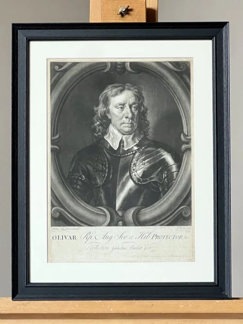 fig 3. Framed monochrome mezzotint print depicting Oliver Cromwell in armour set within an oval cartouche.