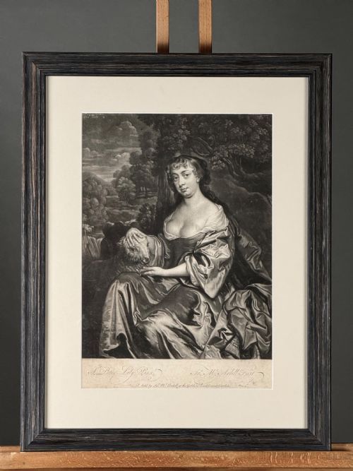 fig 2. A framed monochrome mezzotint print portraying Elizabeth Hamilton seated outdoors with a lamb, presented in a dark wooden frame with a pale mount.