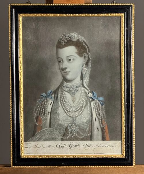 fig 4. A framed pair of 18th-century monochrome mezzotint portraits depicting King George III and Queen Charlotte in decorative ebonised and gilt wood frames.