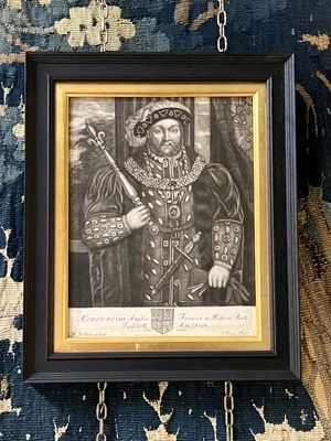 fig 2. A framed monochrome mezzotint portrait of King Henry VIII featuring a gilt inner slip mounted inside a black wooden frame.
