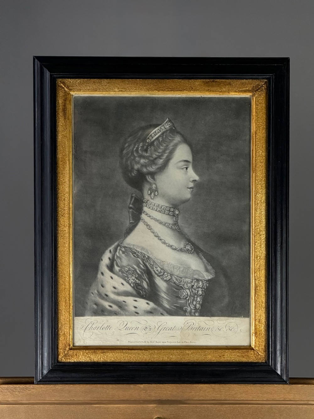 A framed 18th-century profile portrait mezzotint of Queen Charlotte set within a black outer frame and gilded inner slip. View III
