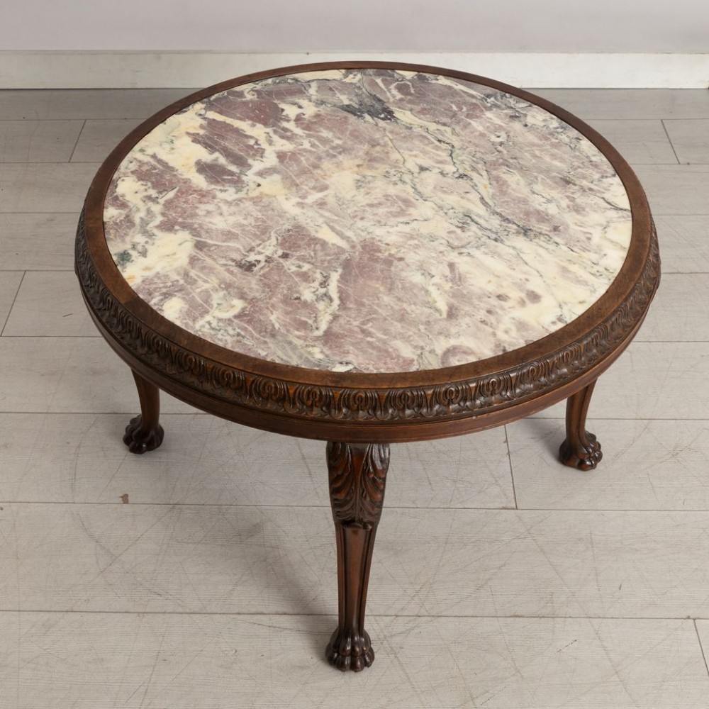 A round French walnut coffee table featuring a variegated pink and cream marble top, carved egg-and-dart moulding, and cabriole legs ending in claw-and-ball feet. View II