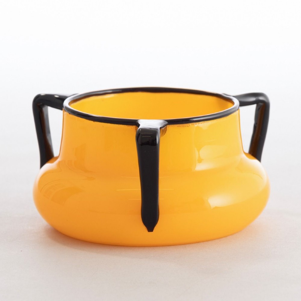 An orange art glass vessel with a squat rounded body, dark black rim, and three black glass handles attached around the top edge.