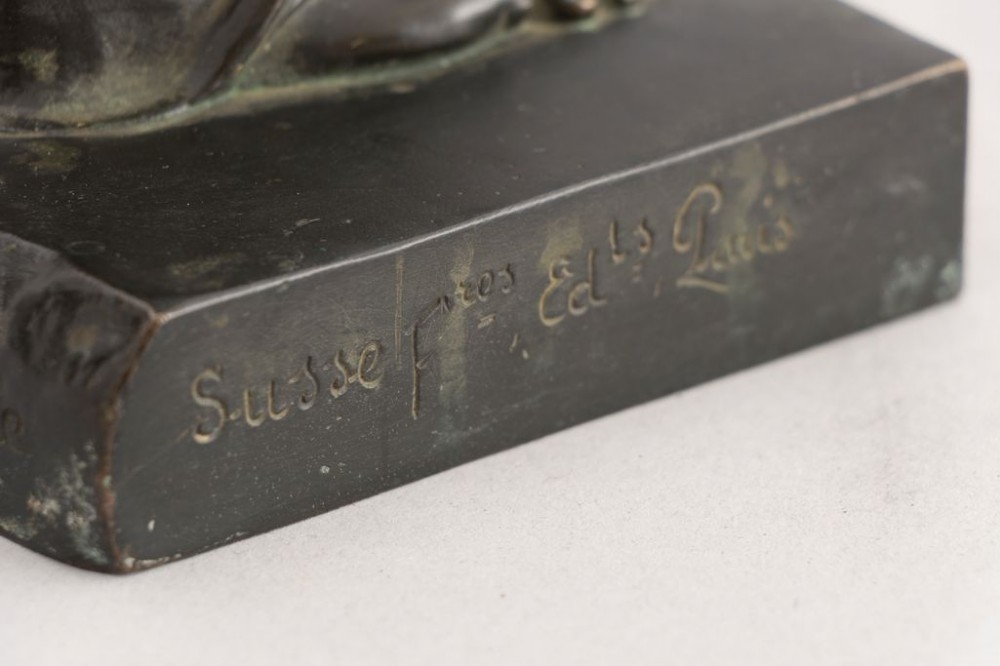A dark brown bronze sculpture depicting the Venus de Milo draped in cloth around the lower body, mounted on an integrated rectangular base. View V