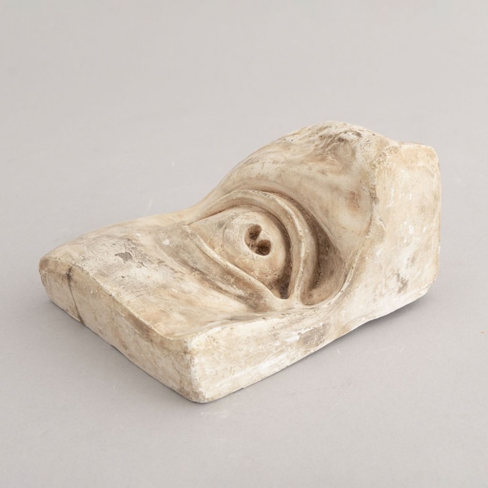 Three 19th-century aged off-white plaster casts displaying sculpted anatomical features including eyes and a nose after Michelangelos David. View IV