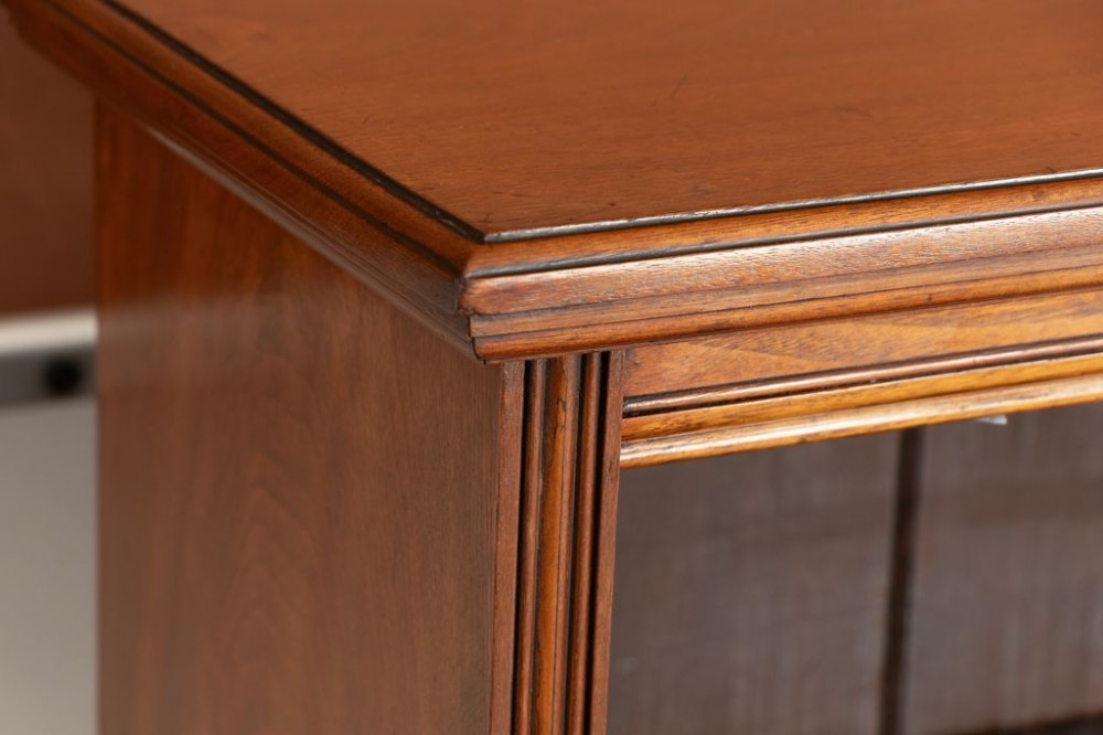 A Victorian walnut open bookcase featuring three adjustable shelves, fluted side pilasters, and a solid plinth base. View III