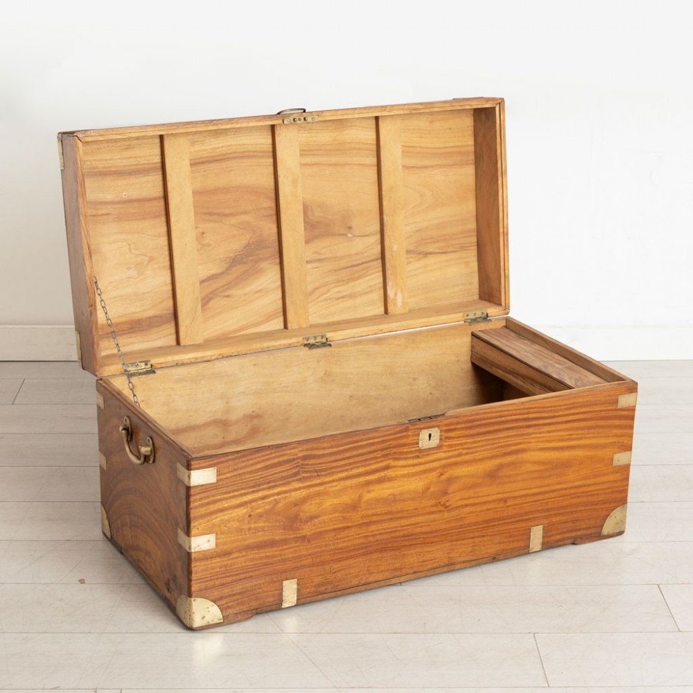 A warm brown rectangular camphor wood campaign chest featuring flush brass corner brackets, recessed carrying handles, and a flat hinged lid. View III