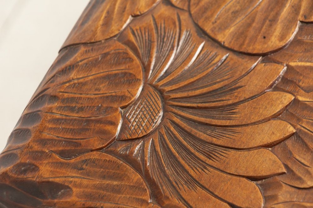 An antique hand-carved wooden side table featuring floral chrysanthemum motifs on the square top and curved legs joined by an X-stretcher. View II