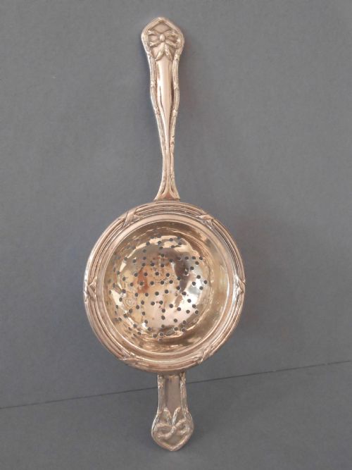 PRETTY ANTIQUE SOLID SILVER TEA STRAINER 1906 - ADDITIONAL PHOTO 1
