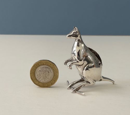 fig 1. A small hallmarked sterling silver pin cushion cast in the form of a standing kangaroo with a dark fabric insert in its back.