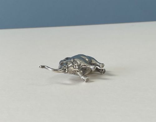 fig 2. A miniature silver novelty pin cushion cast in the shape of an elephant with a dark fabric insert set into its back.