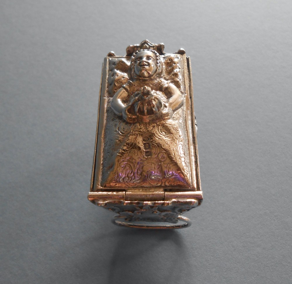 An Edwardian silver novelty snuff box crafted in the form of a miniature wicker cradle with a sleeping infant figure on the hinged lid. View VI