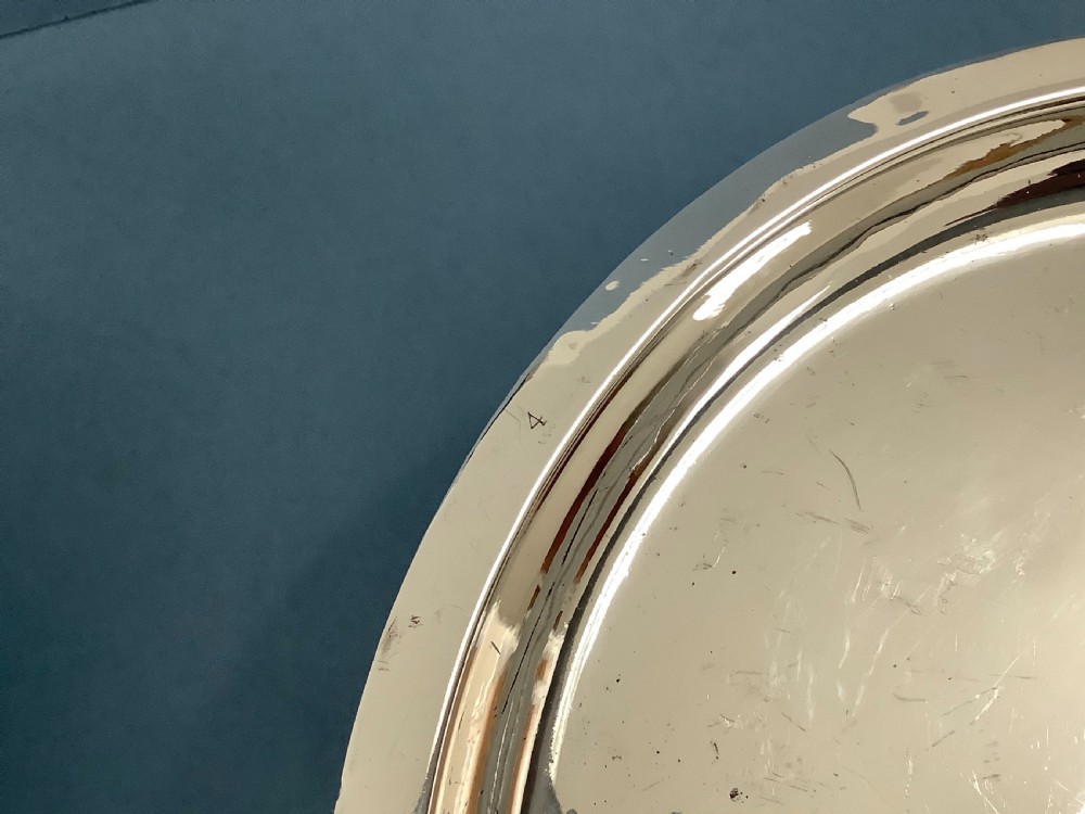 A pair of antique Georgian Old Sheffield Plate oval warming dishes with twin side handles and turned feet. View V