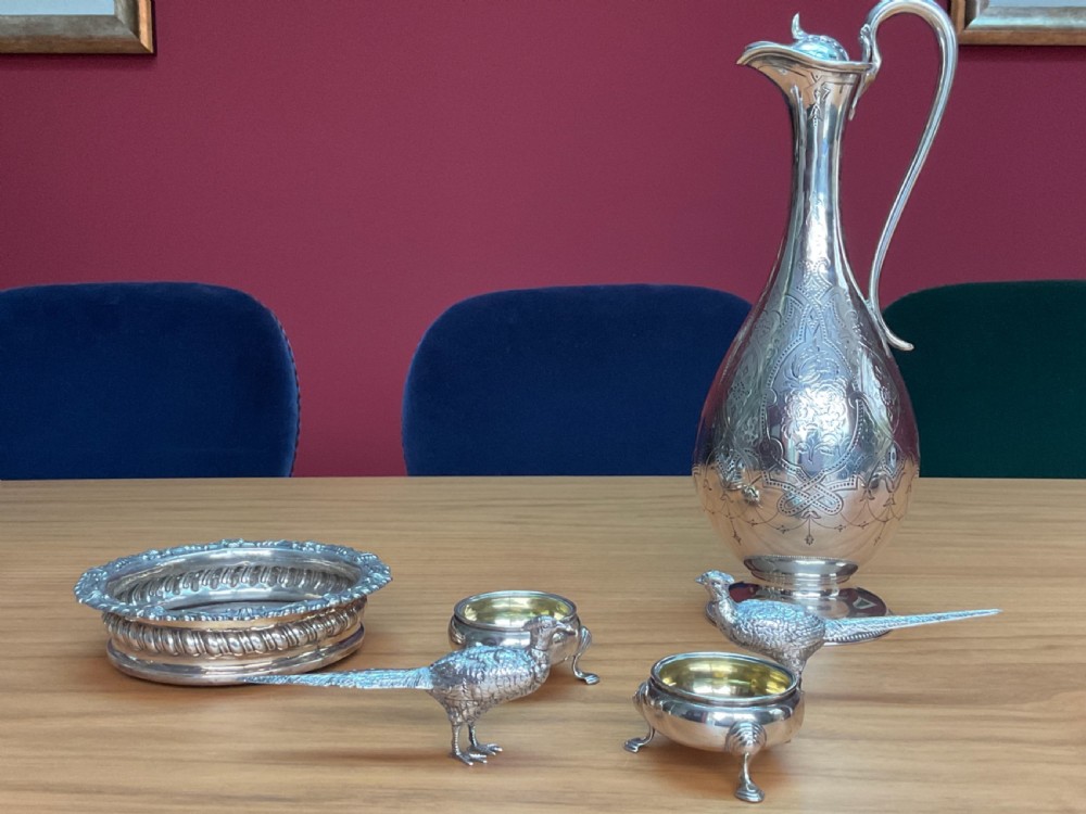 A pair of detailed solid silver pepper shakers crafted in the form of standing pheasants with long tail feathers. View XI
