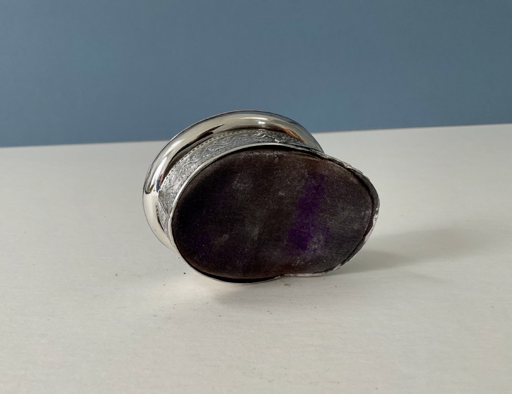 An antique sterling silver novelty pin cushion rendered in the detailed form of a Royal Navy officers cap with a dark fabric top. View IV