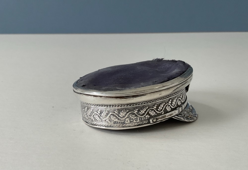 An antique sterling silver novelty pin cushion rendered in the detailed form of a Royal Navy officers cap with a dark fabric top. View VI