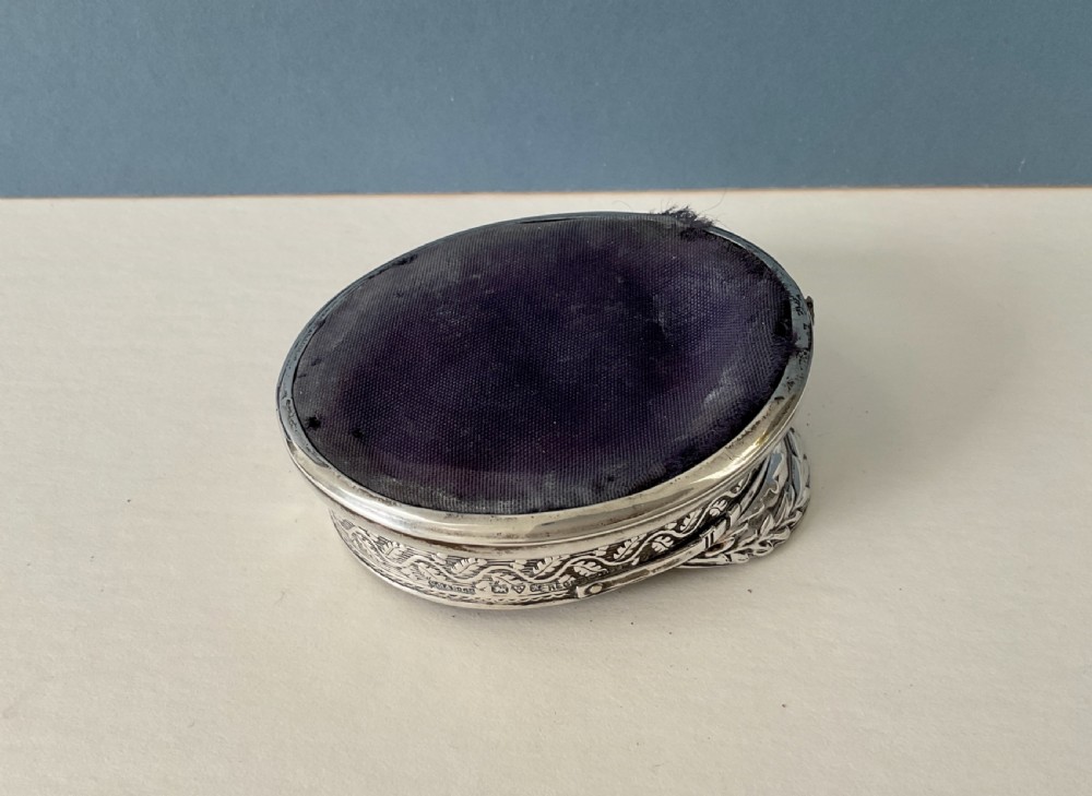 An antique sterling silver novelty pin cushion rendered in the detailed form of a Royal Navy officers cap with a dark fabric top. View VII