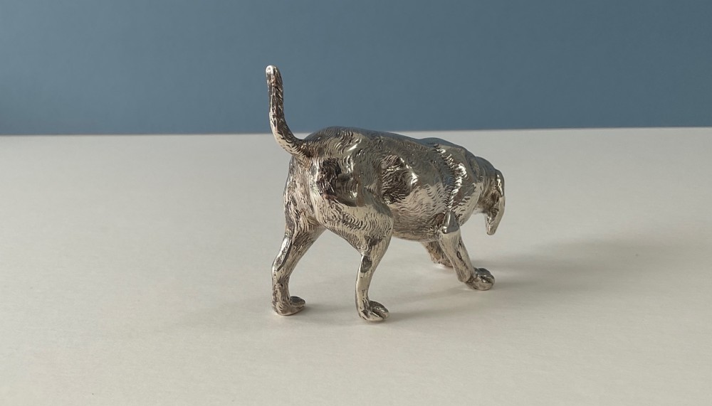 A solid silver novelty pepper pot cast in the detailed form of a standing hunting dog. View III