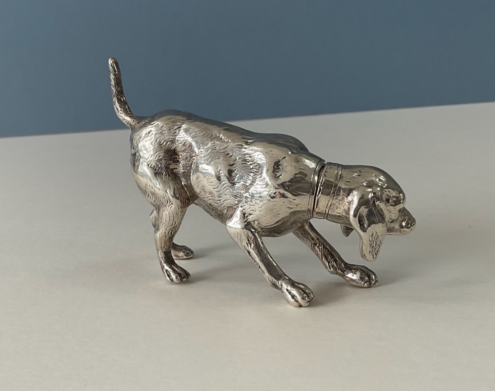 A solid silver novelty pepper pot cast in the detailed form of a standing hunting dog. View IV