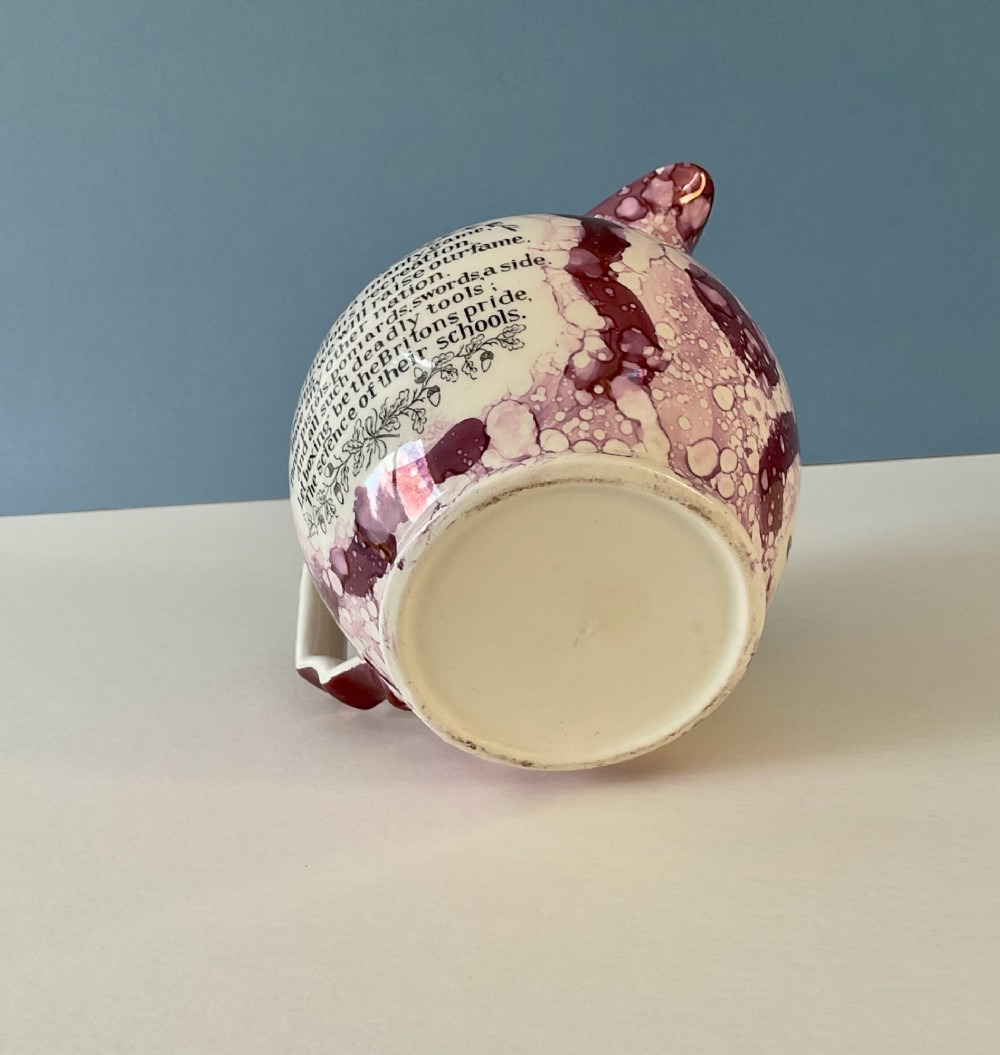 A 19th-century pink splash Sunderland lustre jug decorated with a transfer print depicting two bare-knuckle boxers in a match stance. View V