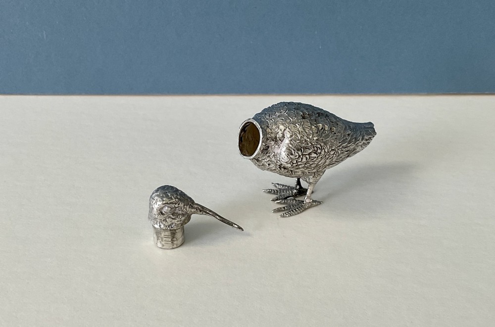 A small silver novelty box sculpted in the form of a standing snipe bird with detailed feather texturing and a long beak. View II