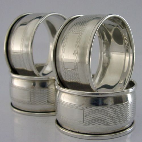 Four English Sterling Silver Engine Turned Napkin Rings 1959