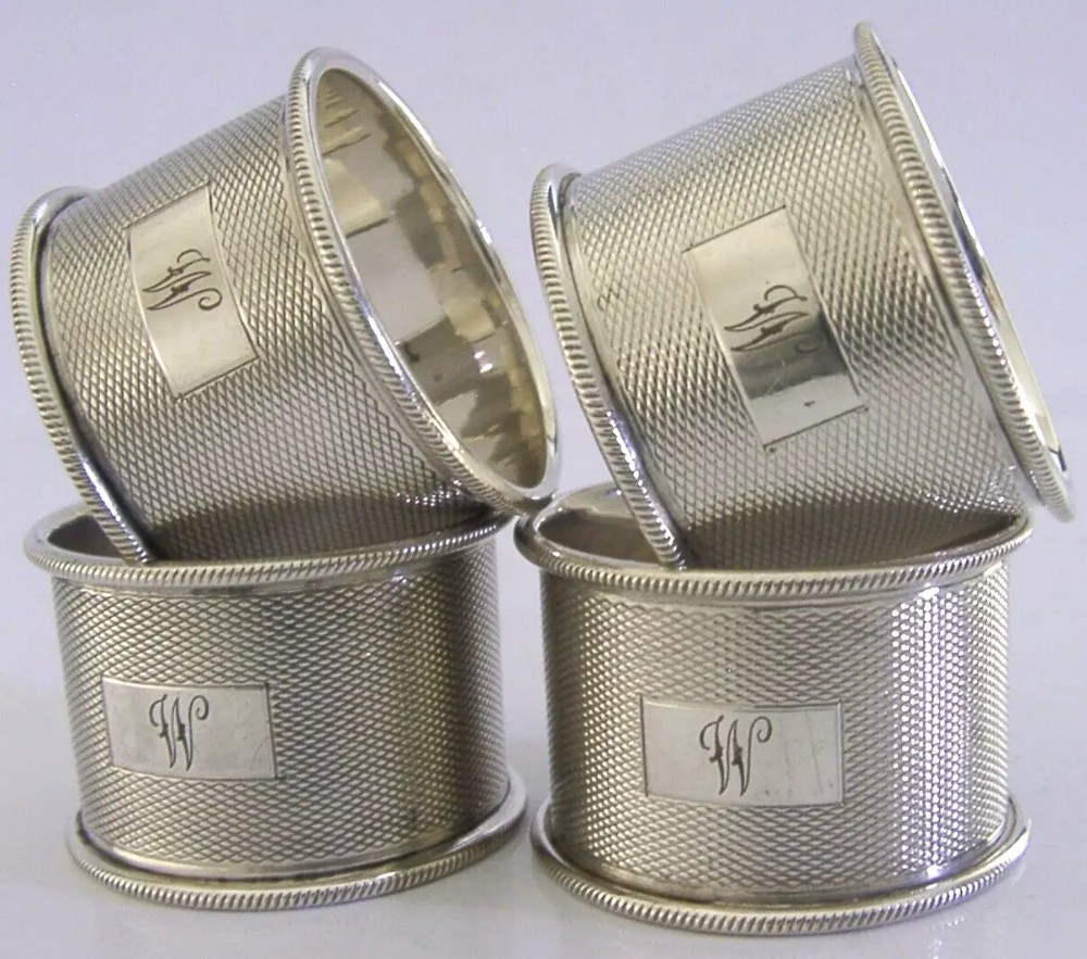 SET of FOUR ENGLISH STERLING SILVER ENGINE TURNED NAPKIN RINGS 1959 94g
