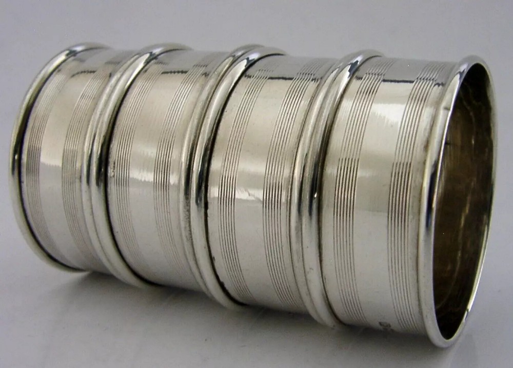 FOUR ENGLISH STERLING SILVER ENGINE TURNED NAPKIN RINGS 1934 ANTIQUE