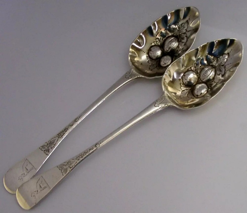 PAIR OF ENGLISH STERLING SILVER PROCTOR FAMILY CRESTED BERRY SERVING SPOONS 1820