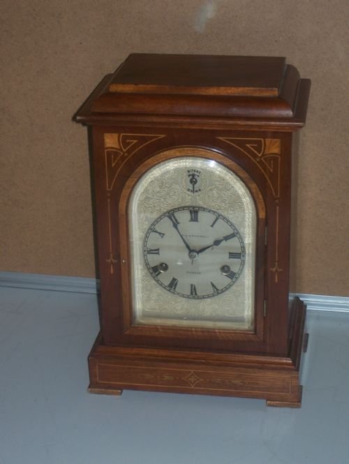 Mahogany Inlaid Mantle Clock with Silvered Dial - Musical on 3 of the Quarters and Then Strike the hours on the Hour.