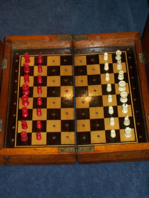 Fine Late Late 19th Century Bone Chess Set in a Folding Mahogany Travelling Case