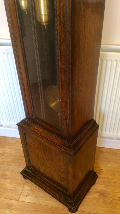fig 1. Triple Weight Westminster Chiming Musical Grandmother or Grandfather Oak Longcase Clock with Glass Door and Strike Silent