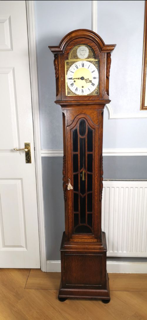Quarter Chiming & Hour Striking English Dwarf Grandfather or Grandmother Musical Longcase Clock of Good Warm Oak & Astagal Glazed Trunk Door on Bun Feet.