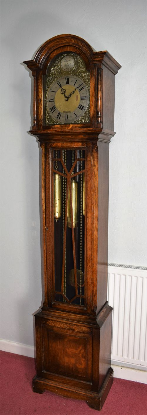 Camerer Cuss Triple Weight Musical Chiming Grandmother or Grandfather Oak Longcase Clock with Glazed Trunk Door and Peerless Embee 8 Day Movement. (Video Available to Hear Chimes on Request.)
