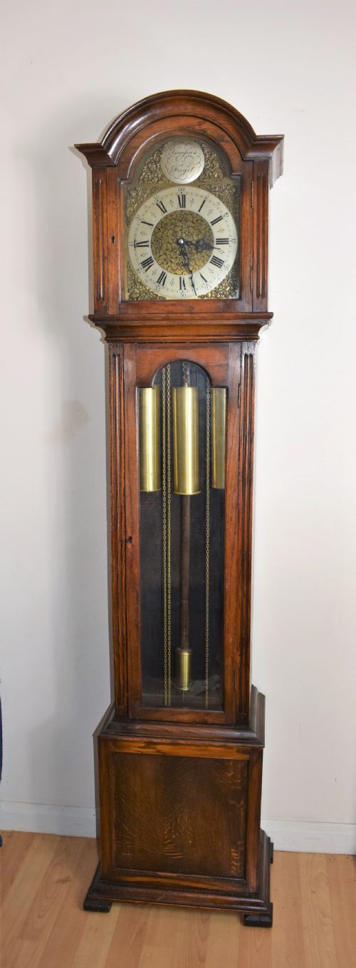 English Triple Weight Westminster Musical Chiming Grandmother or Grandfather English Oak with Glazed Trunk Door Longcase Clock. Circa 1920s