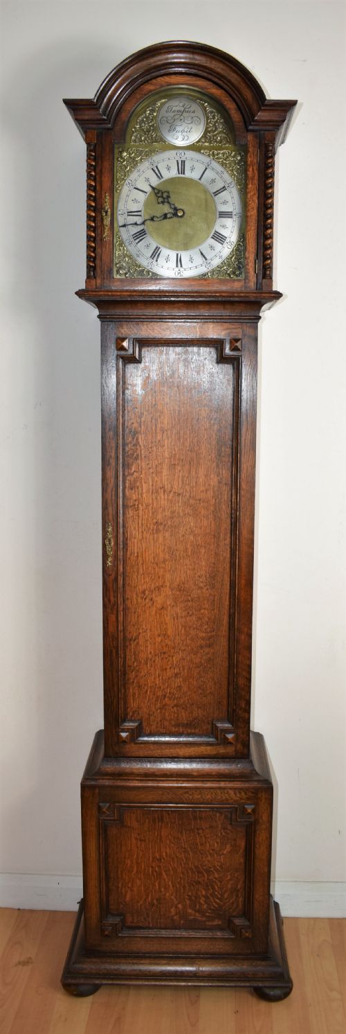 English Triple Weight Musical Chiming Grandmother or Grandfather Oak Longcase Clock with Barley Twist Columns Circa 1920