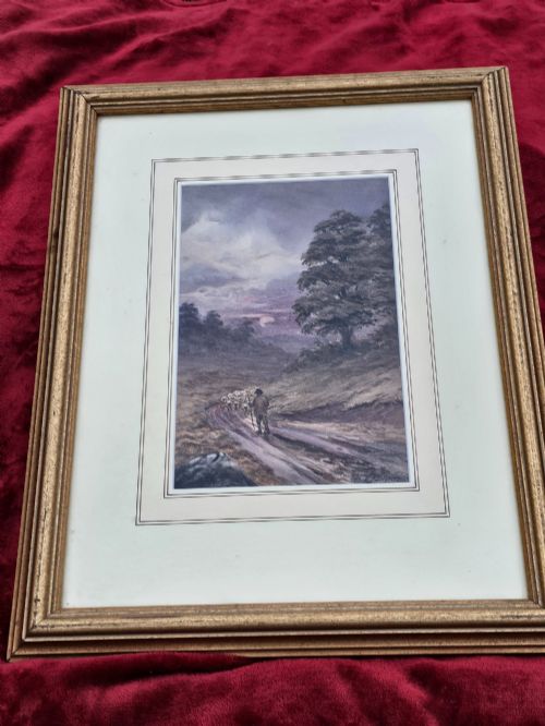 fig 1. A framed watercolour painting depicting a shepherd driving a flock of sheep along a dirt track under a purple twilight sky.