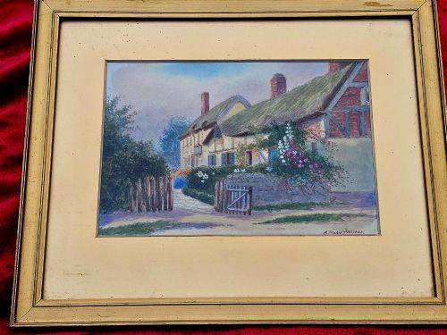 fig 1. An early 20th-century framed watercolour painting depicting a country cottage with a thatched roof, brickwork, and flowering garden.